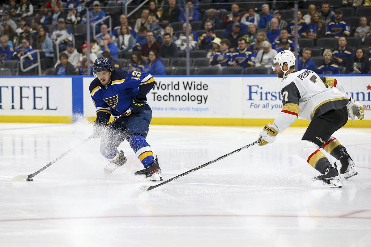 St. Louis Blues' Robert Thomas (18) controls the puck as Vegas Golden Knights' Alex Pietrangelo ...