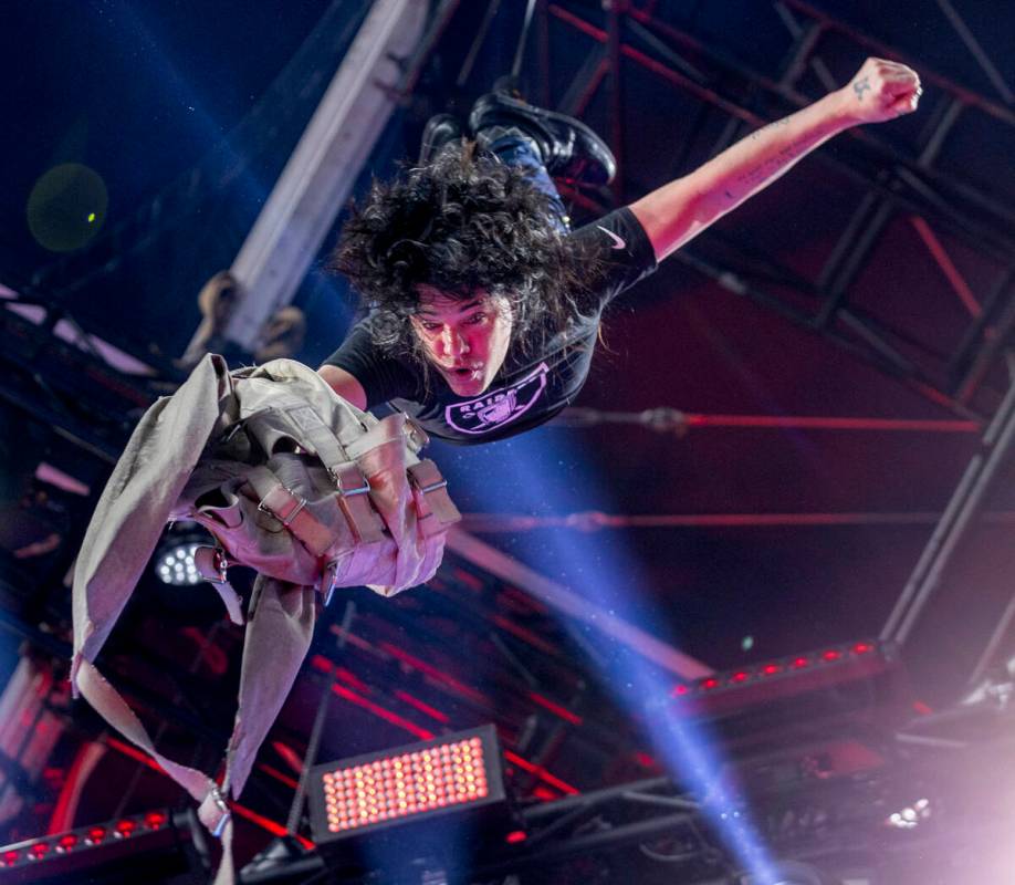 Illusionist Criss Angel hangs upside down after getting out of a straight jacket on the Draft T ...