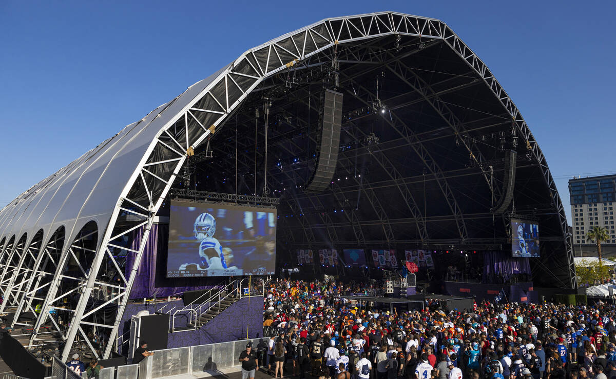 The crowd outside the NFL Draft Stage watches selections being made during day two of the NFL d ...