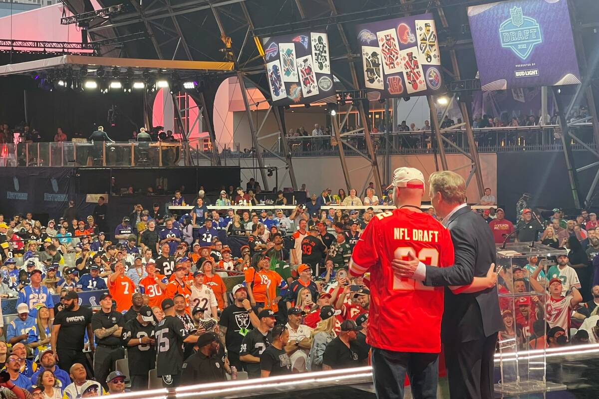 NFL Commissioner Roger Goodell poses with a Kansas City Chiefs fan, who took part in the team's ...