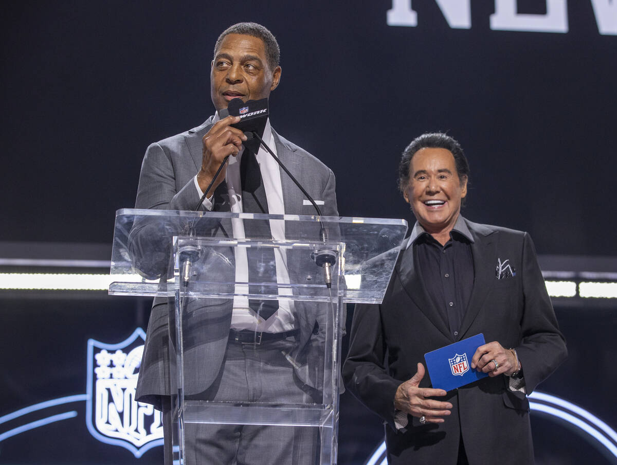 Marcus Allen and Wayne Newton announce 90th player selection at the Draft Theater during the se ...