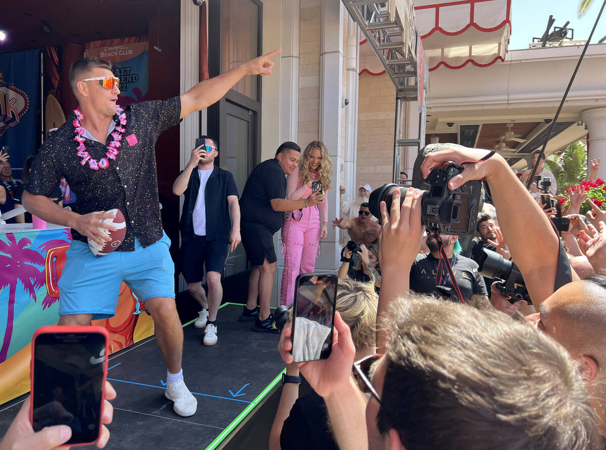 Rob Gronkowski tosses out signed footballs during Gronk Beach party at Encore Beach Club on the ...
