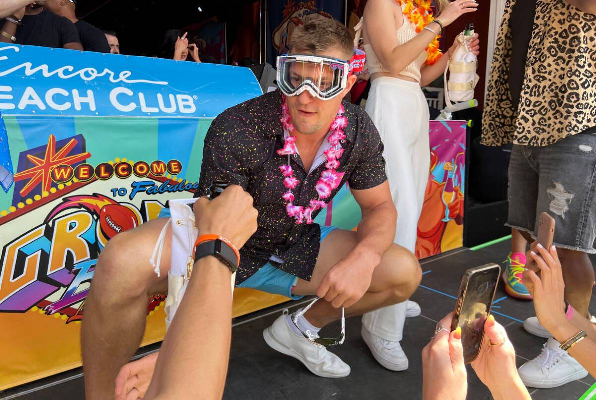 Rob Gronkowski prepares to spray sparkling wine on the crowd during Gronk Beach party at Encore ...