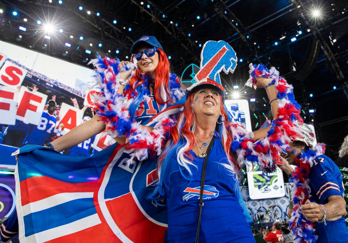 Bills fans Cheryl Barber, bottom, and Angela Ferguson, from Las Vegas, during day two of the NF ...