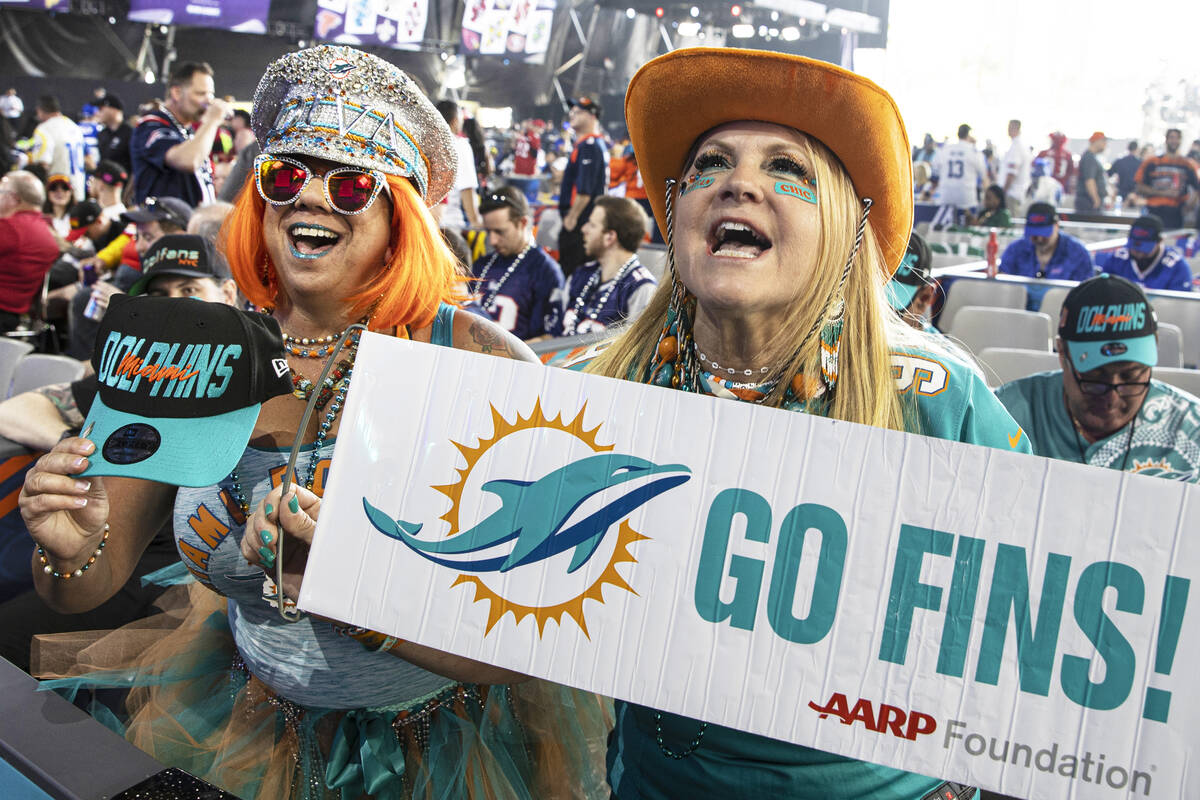 Miami Dolphins fans Mirta Cordoves, right, and Jen Schultz, from Miami, Fla., during day two of ...