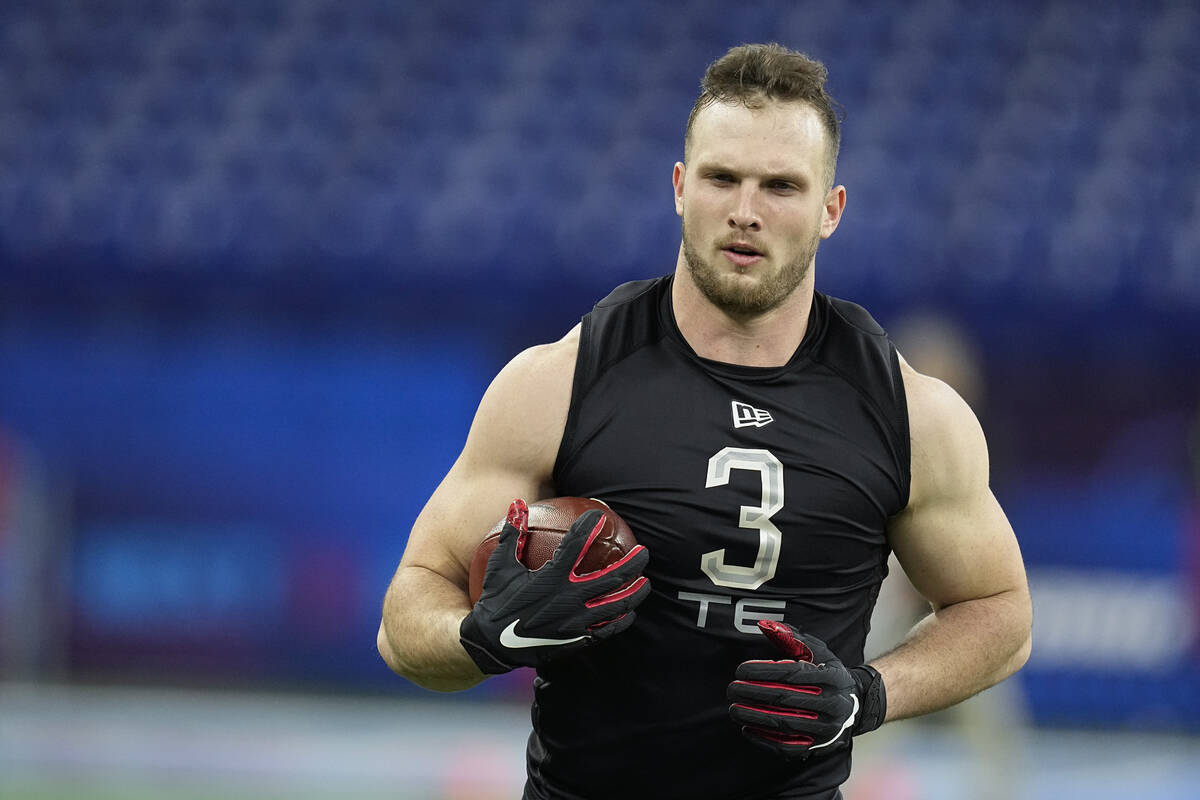 San Diego State tight end Daniel Bellinger runs a drill during the NFL football scouting combin ...