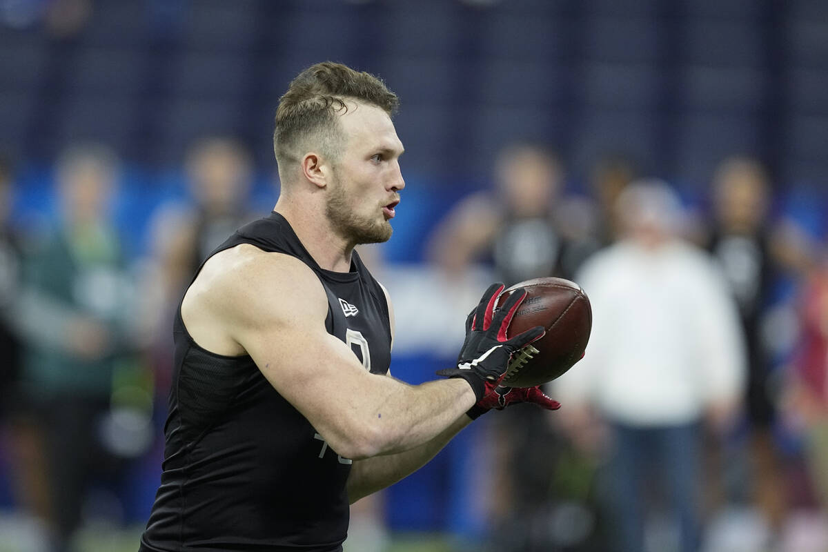 San Diego State tight end Daniel Bellinger runs a drill during the NFL football scouting combin ...