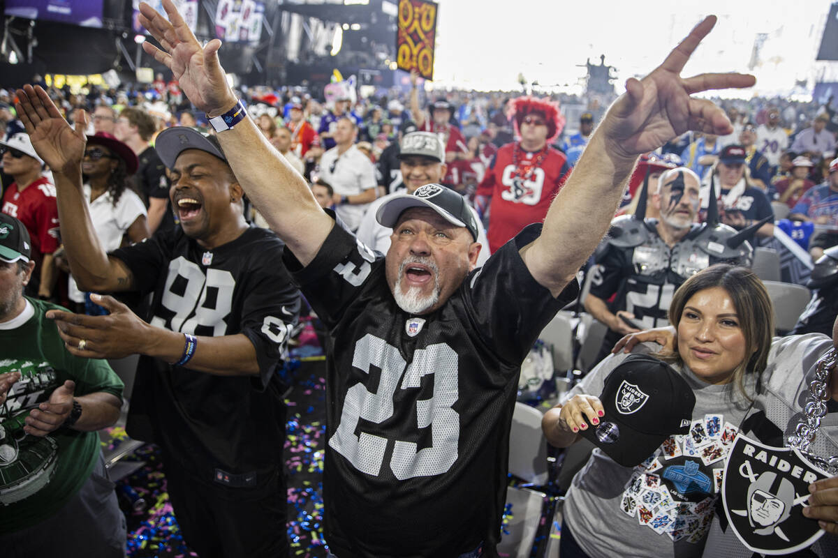 Raider fan Lucky Gonzalez, from Stockton, Calif., celebrates after Las Vegas made a draft pick ...