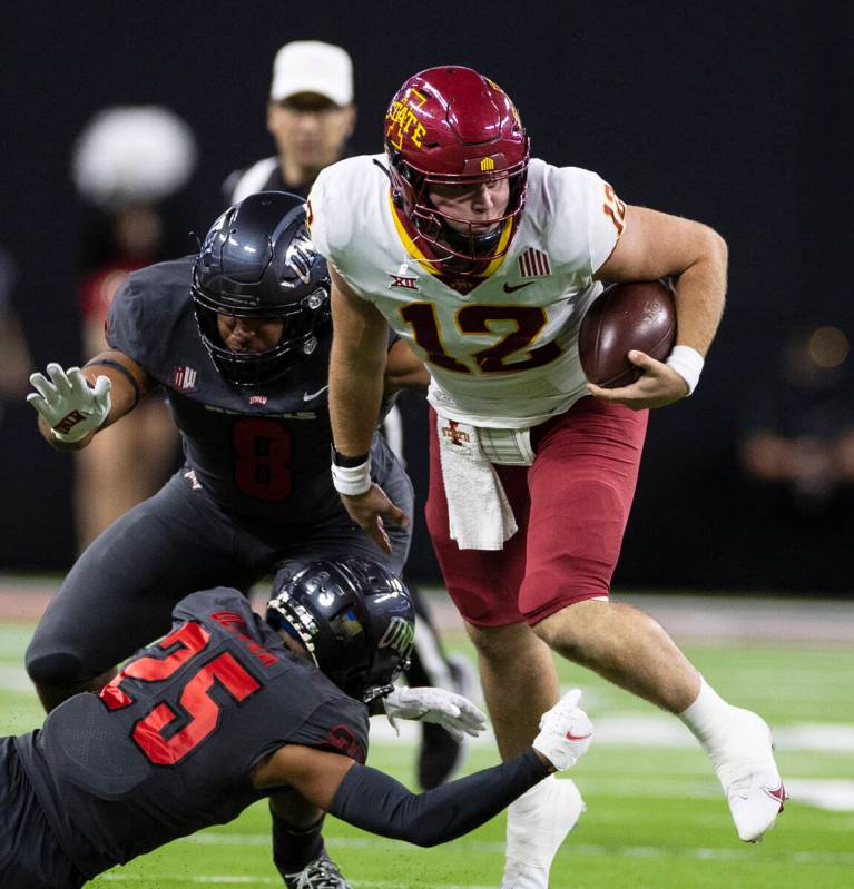 Iowa State CycloneÕs quarterback Brock Purdy (15) runs with the ball as UNLV Rebels defens ...