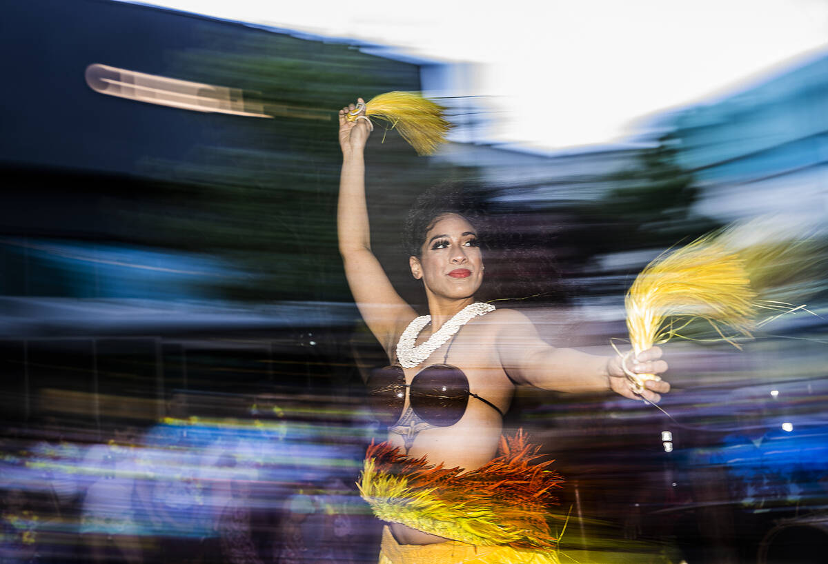 Taua Manuma, with Hot Lava Productions, dances during Lei Day, a new parade to celebrate and ki ...