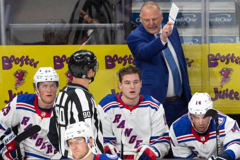 Rangers head coach Gerard Gallant communicates with a referee during the first period of an NHL ...
