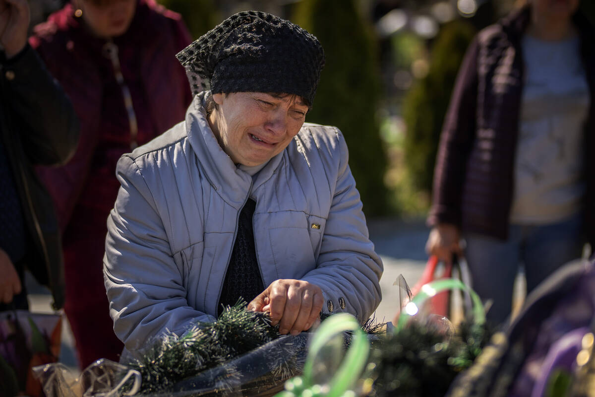 The mother of Oleksandr Mozheiko, 31, an Irpin Territorial Defense soldier killed by Russian ar ...