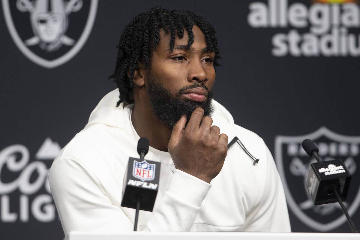 Raiders cornerback Nate Hobbs takes media questions during the post game press conference after ...