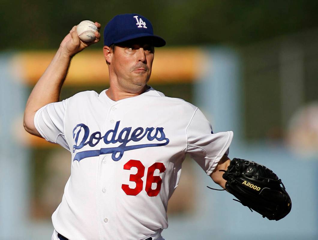 Los Angeles Dodgers' Greg Maddux pitches in the first inning of an MLB baseball game against th ...