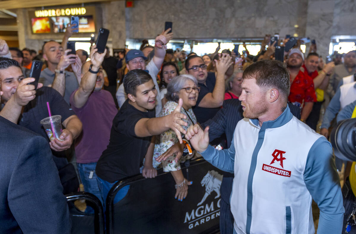 Canelo Alvarez greets fans during boxing Grand Arrivals at the MGM Grand on Tuesday, May 3, 202 ...