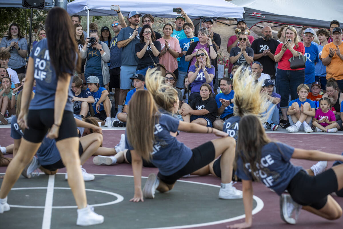 The crowd enjoys watching the Foothill High School dance team performing as part of a celebrati ...