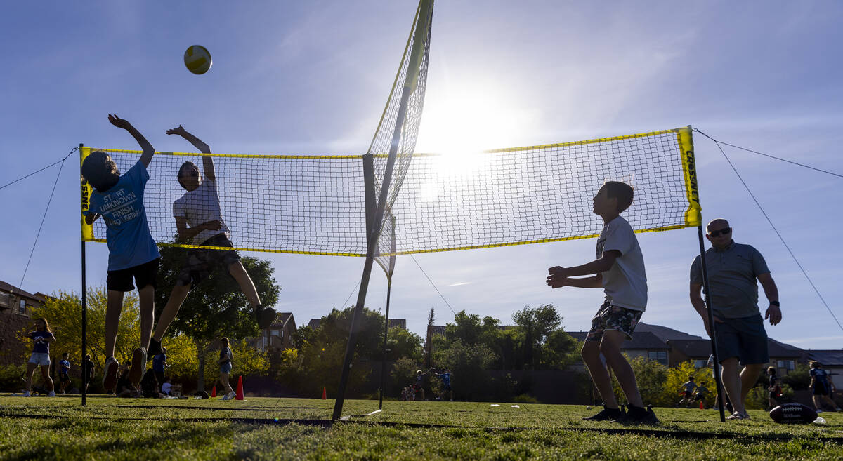 Kids play 4-way volleyball as part of a celebration of life for Austen Russell, 9, who died whe ...