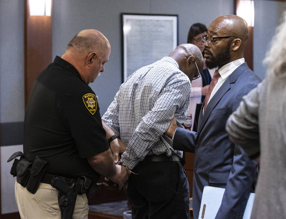 Wendell Melton, center, is comforted by his attorney Jonathan MacArthur, right, on Wednesday, M ...