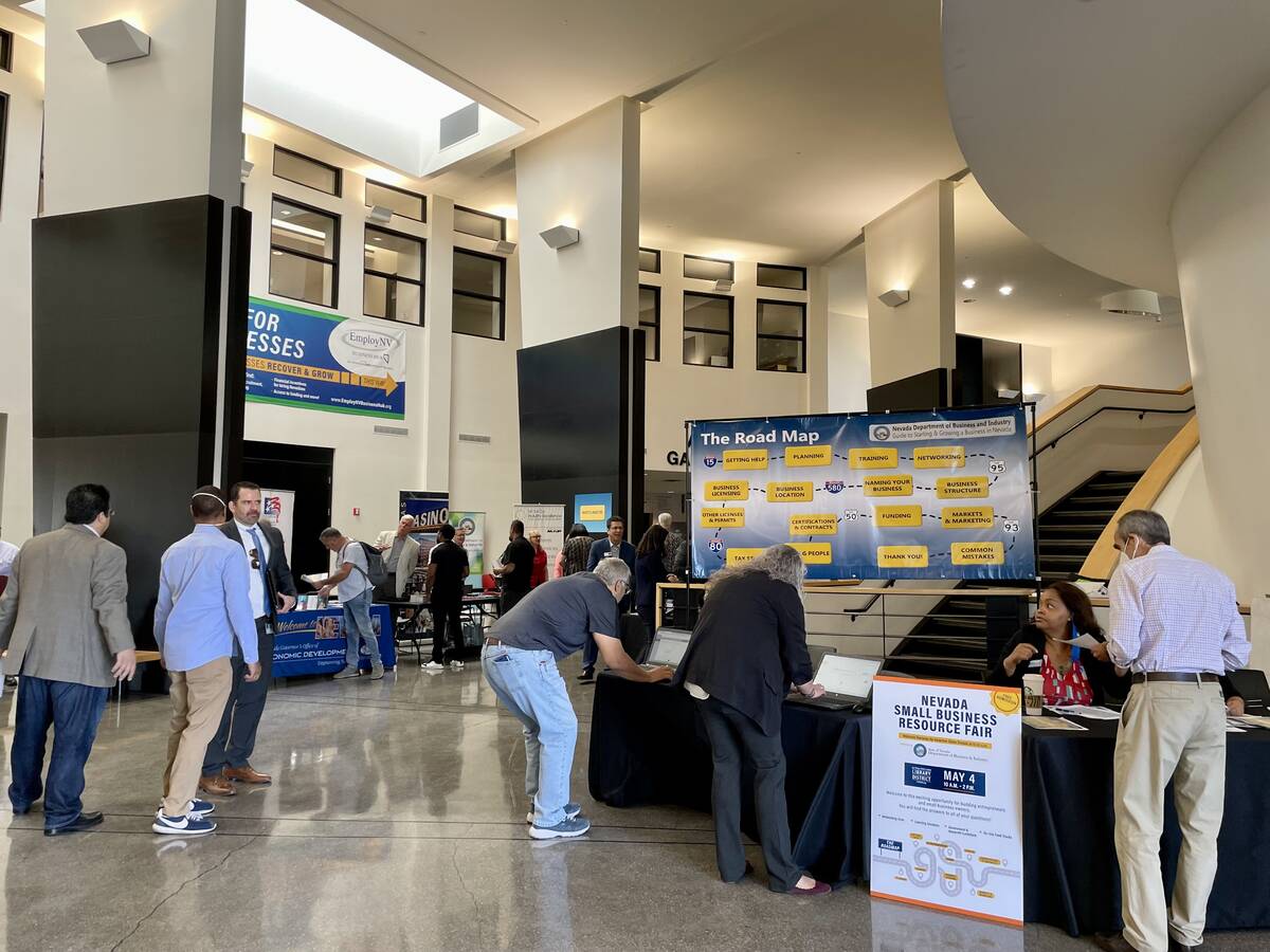People walk around the Small Business Resource Fair on Wednesday, May 4, 2022 at the Sahara Wes ...