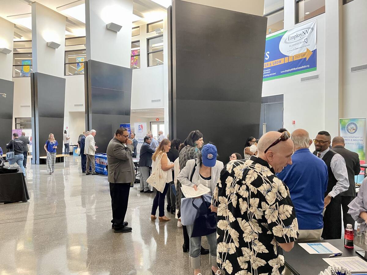People walk around the Small Business Resource Fair on Wednesday, May 4, 2022 at the Sahara Wes ...