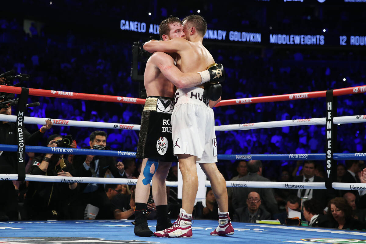 Saul "Canelo" Alvarez, left, and Gennady Golovkin, embrace following their WBC, WBA, ...