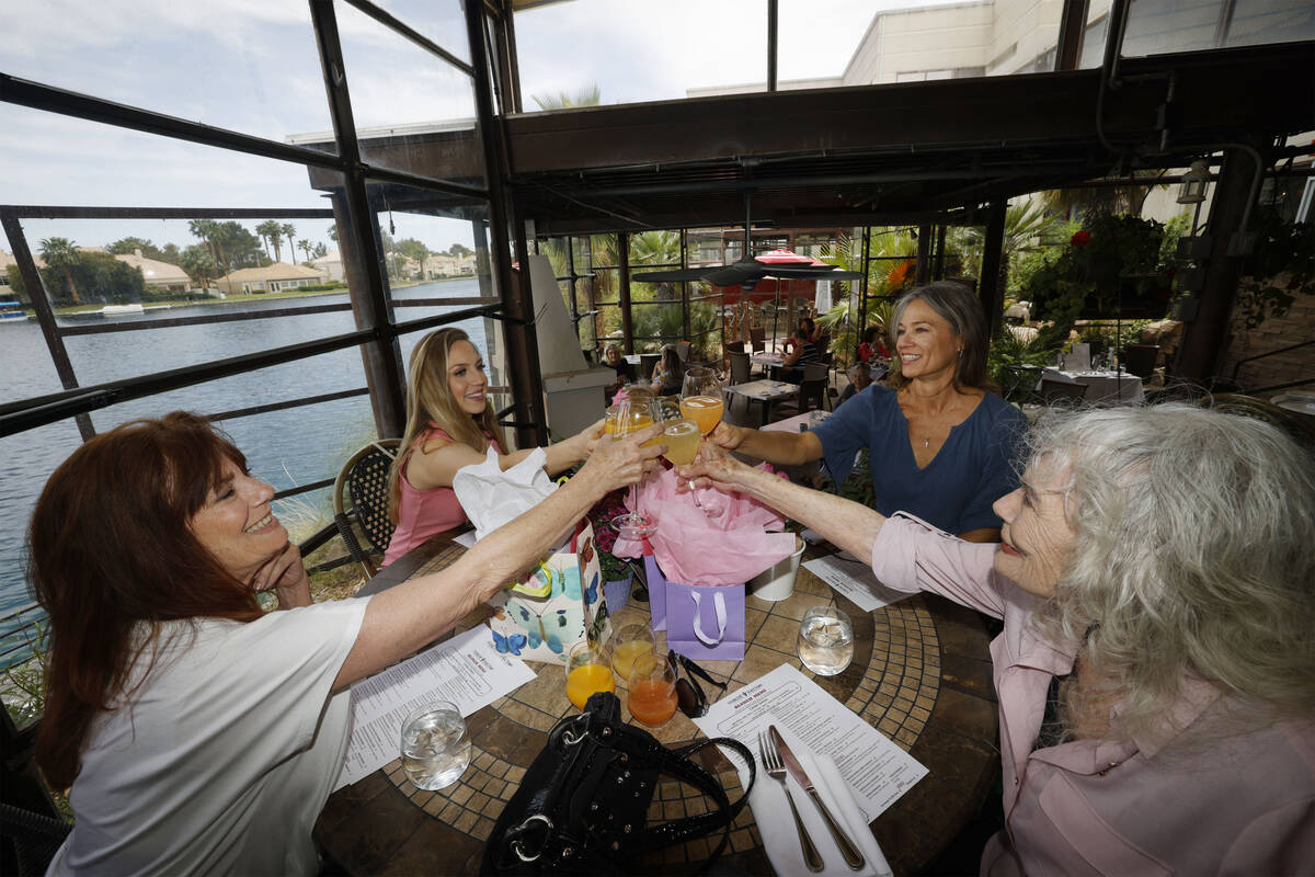 Joanne Young, 91, of Las Vegas, right, celebrates an early Mother's Day at Marche Bacchus, Thur ...