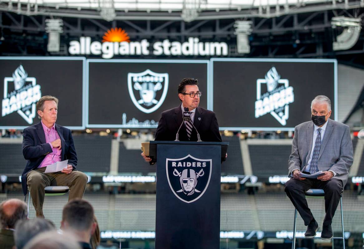 Jeremy Aguero, center, is joined by Maury Gallagher, left, and Gov. Steve Sisolak during a pres ...