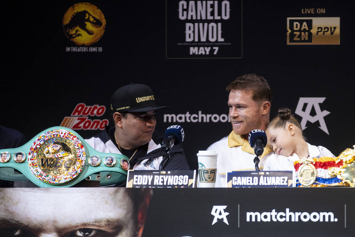 Boxing trainer Eddy Reynoso, from left, Saul “Canelo” Alvarez, center, with his d ...