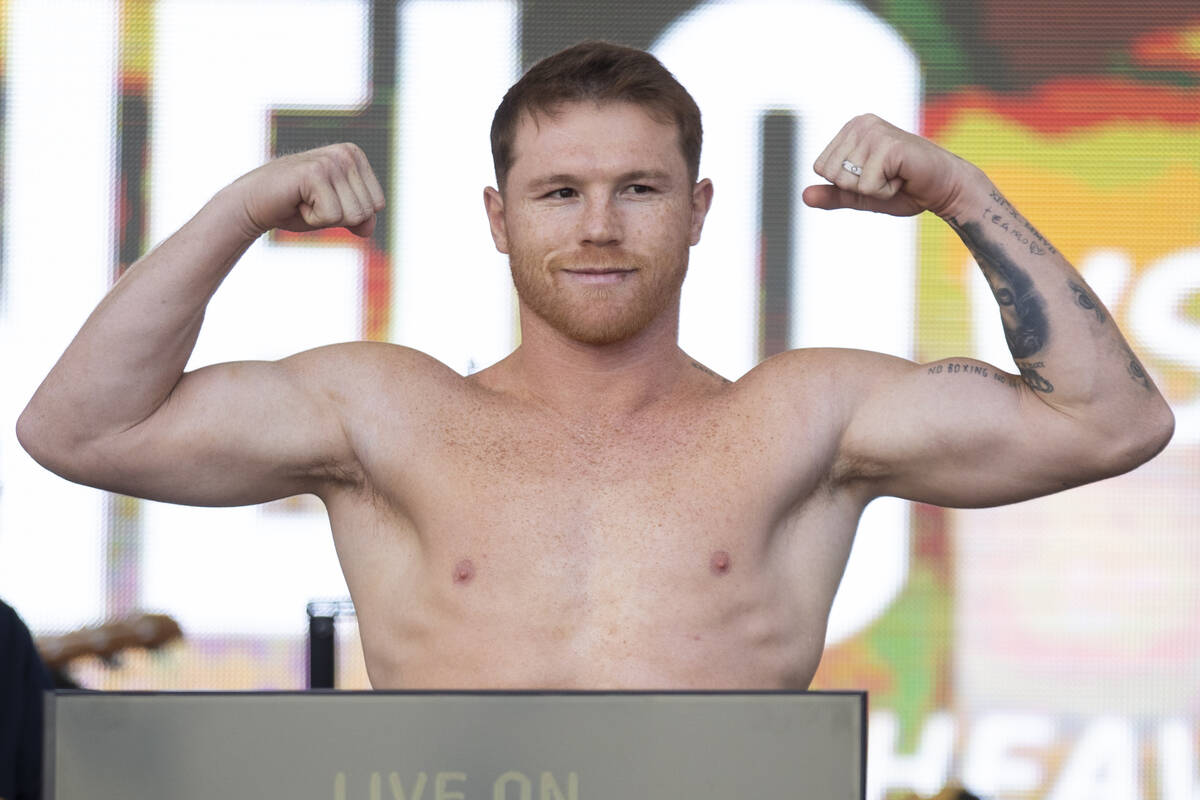 Saul “Canelo” Alvarez stands on a scale during a ceremonial weigh-in event at Tos ...