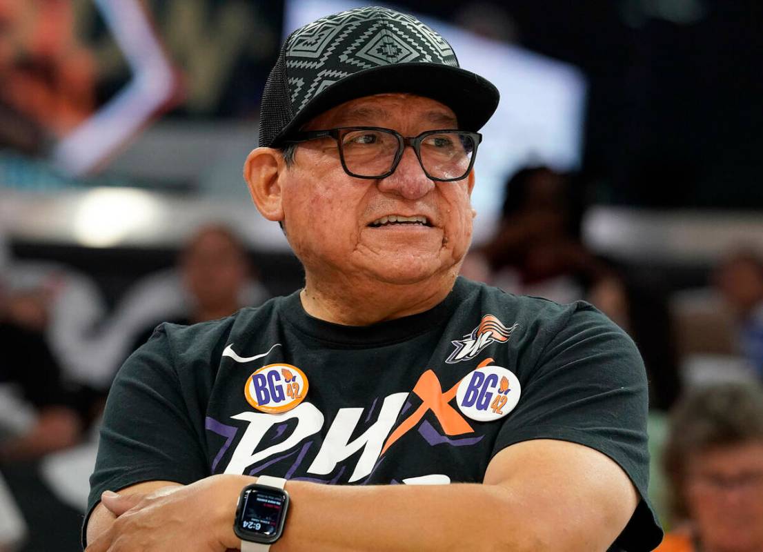 Phoenix Mercury fan Michael Augustine wears buttons referring to Mercury's Brittney Griner befo ...