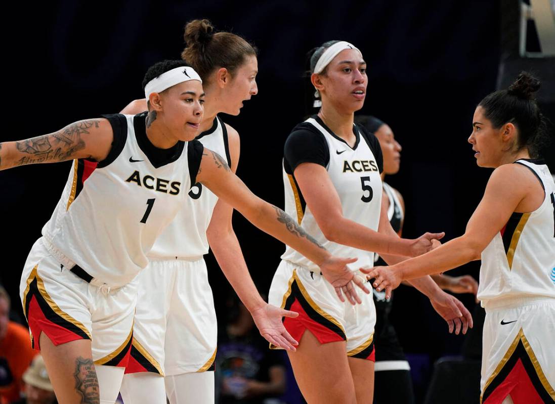 Las Vegas Aces' Kierstan Bell (1) Theresa Plaisance (55) Dearica Hambry (5) greet Kelsey Plum ( ...