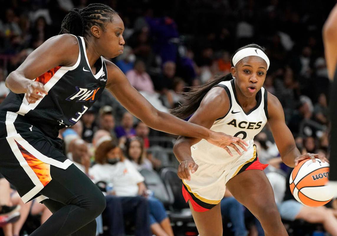 Las Vegas Aces' Jackie Young (0) dribbles past Phoenix Mercury's Tina Charles (31) during the s ...