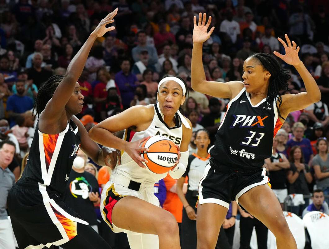 May 6, 2022; Phoenix, Arizona; USA; AcesÕ AÕja Wilson (22) spins in the post against ...