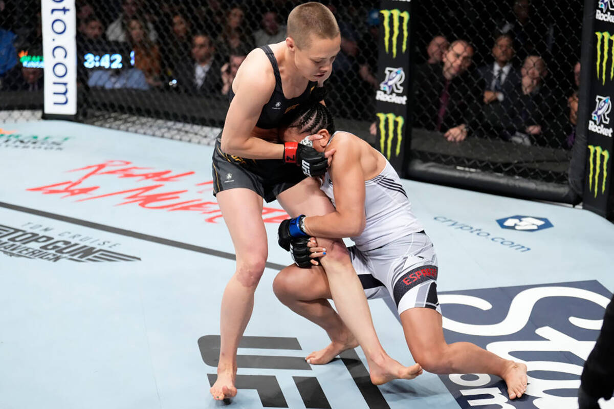 Carla Esparza attempts to take down Rose Namajunas in the UFC strawweight championship fight du ...