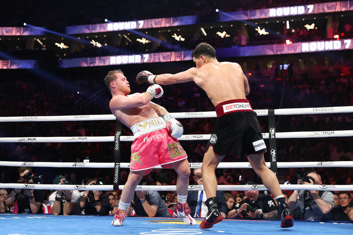 Dmitry Bivol, right, throws a punch against Saul “Canelo” Alvarez in the seventh ...
