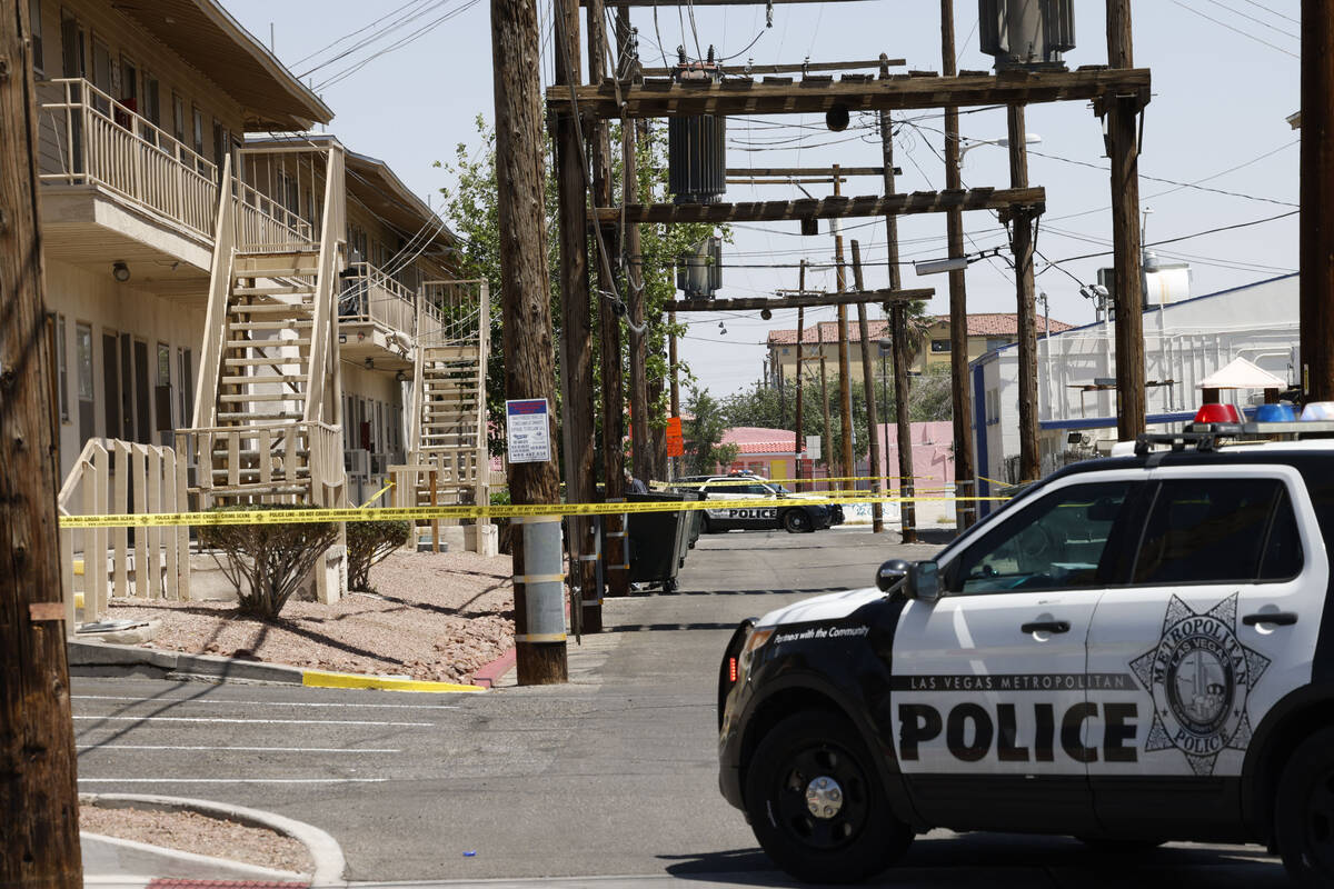 Las Vegas police investigate around the 200 block of Maryland Parkway, near Fremont Street, Sun ...