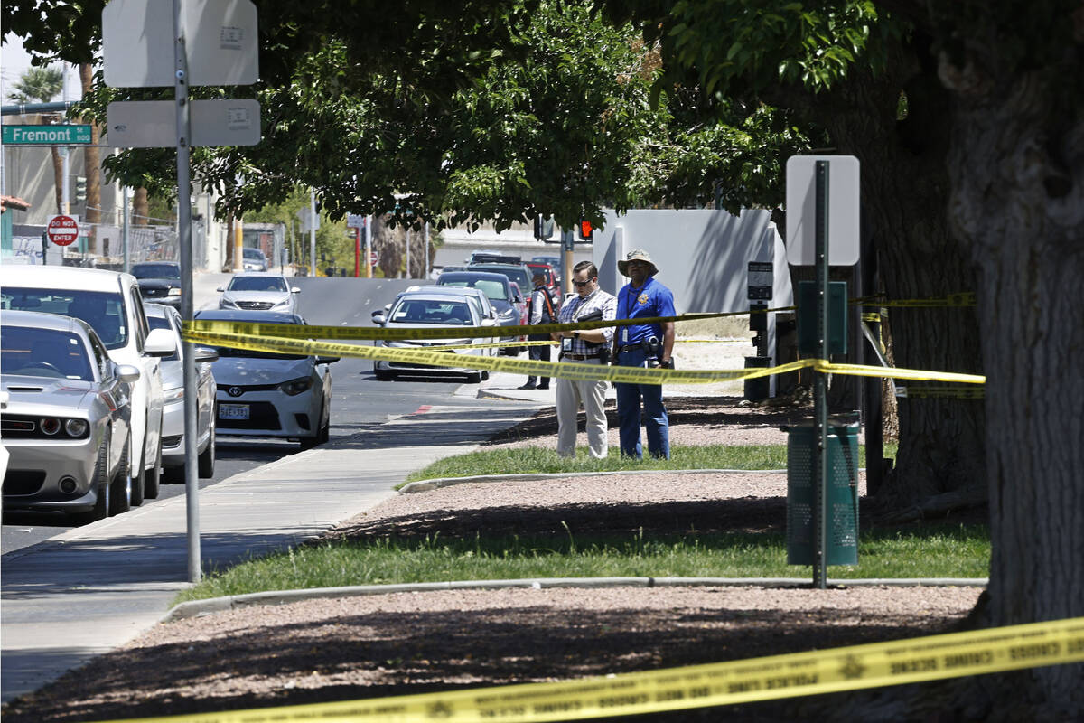 Las Vegas police investigate around the 200 block of Maryland Parkway, near Fremont Street, Sun ...