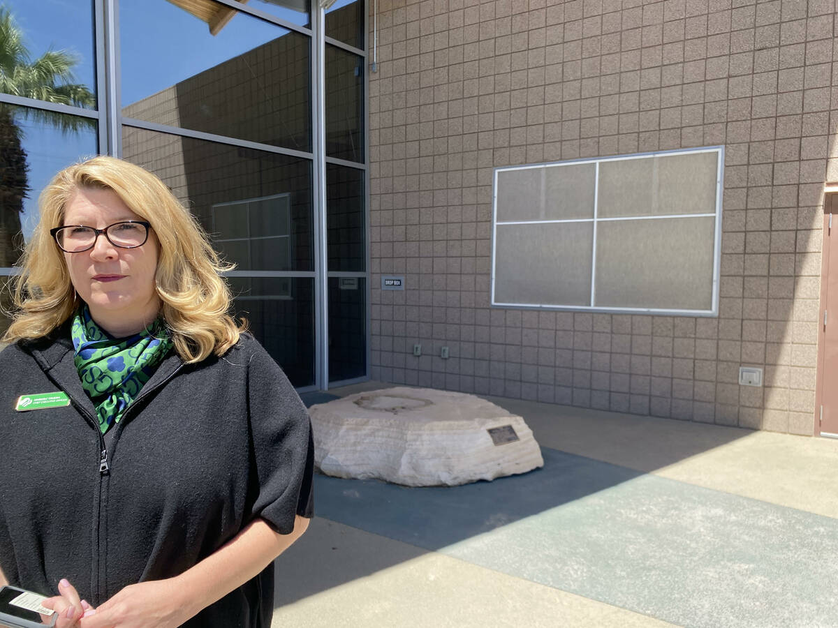 Kimberly Trueba, CEO of the Girl Scouts of Southern Nevada, stands in front of a pedestal where ...