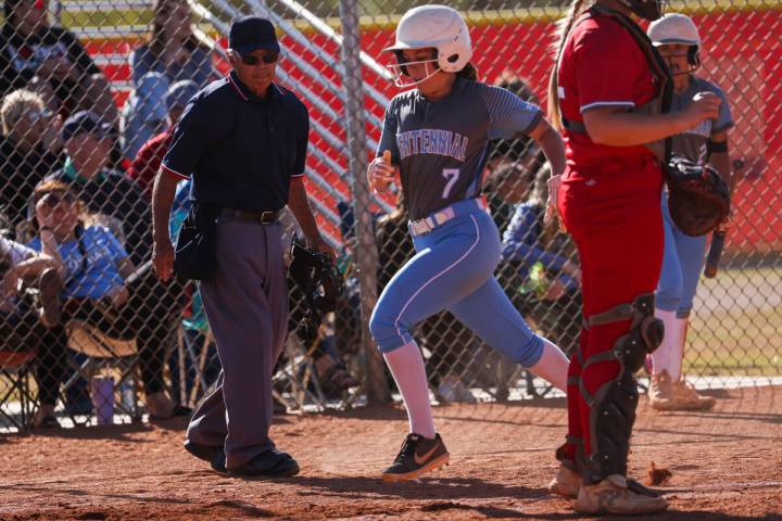 Centennial's Pence Justice (7) scores a run against Arbor View during a softball game in the Cl ...