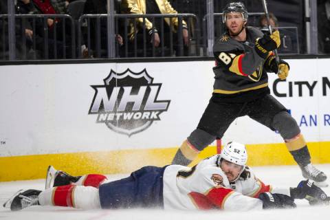 Golden Knights center Jonathan Marchessault (81) watches his slap shot while Panthers defensema ...