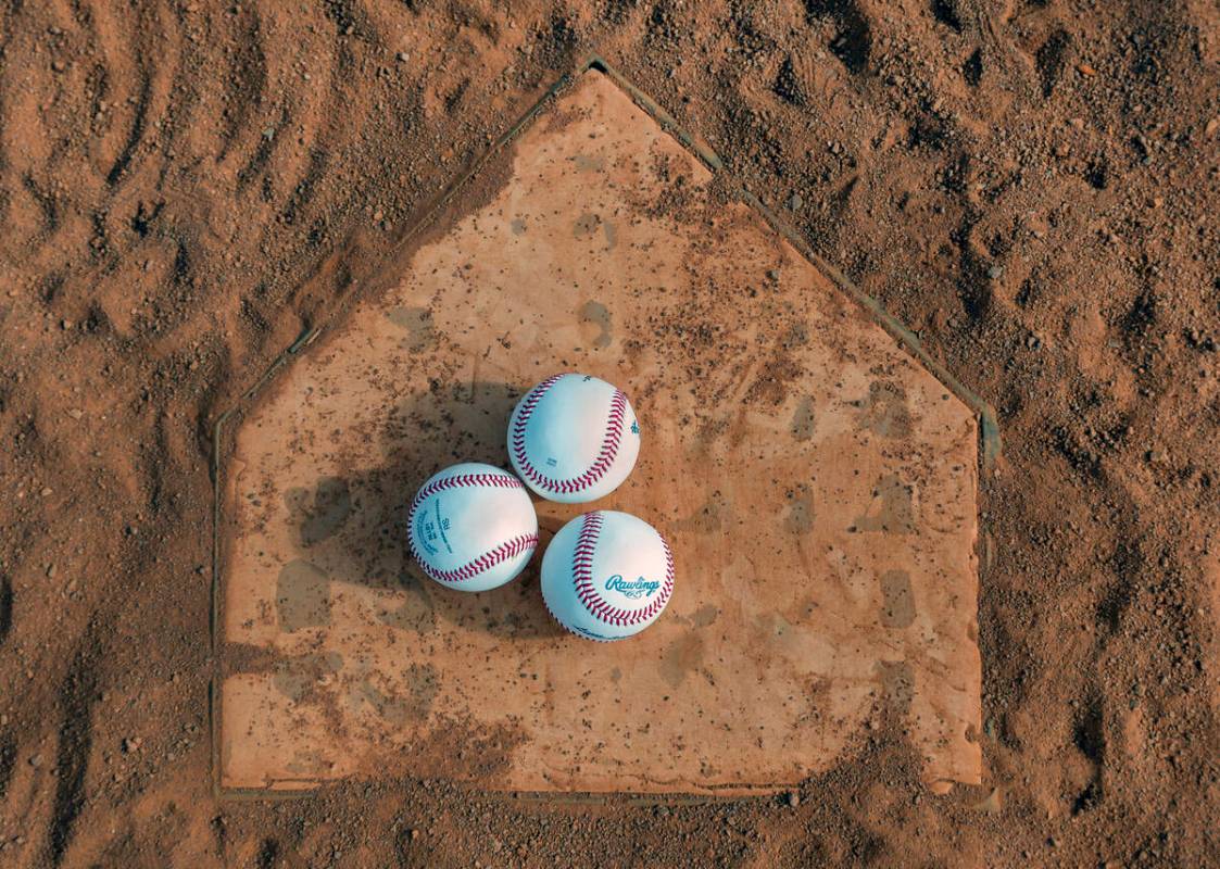 Baseballs are set on home plate as a game between the Brewers and Giants is due to start for a ...