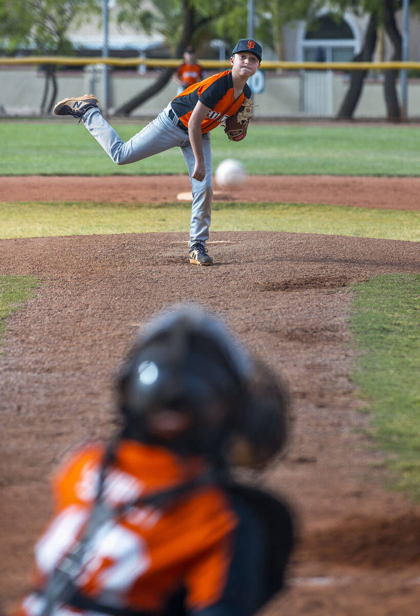 Giants pitcher Patrick Harris (9) throws a ball towards his catcher during a game versus the Br ...