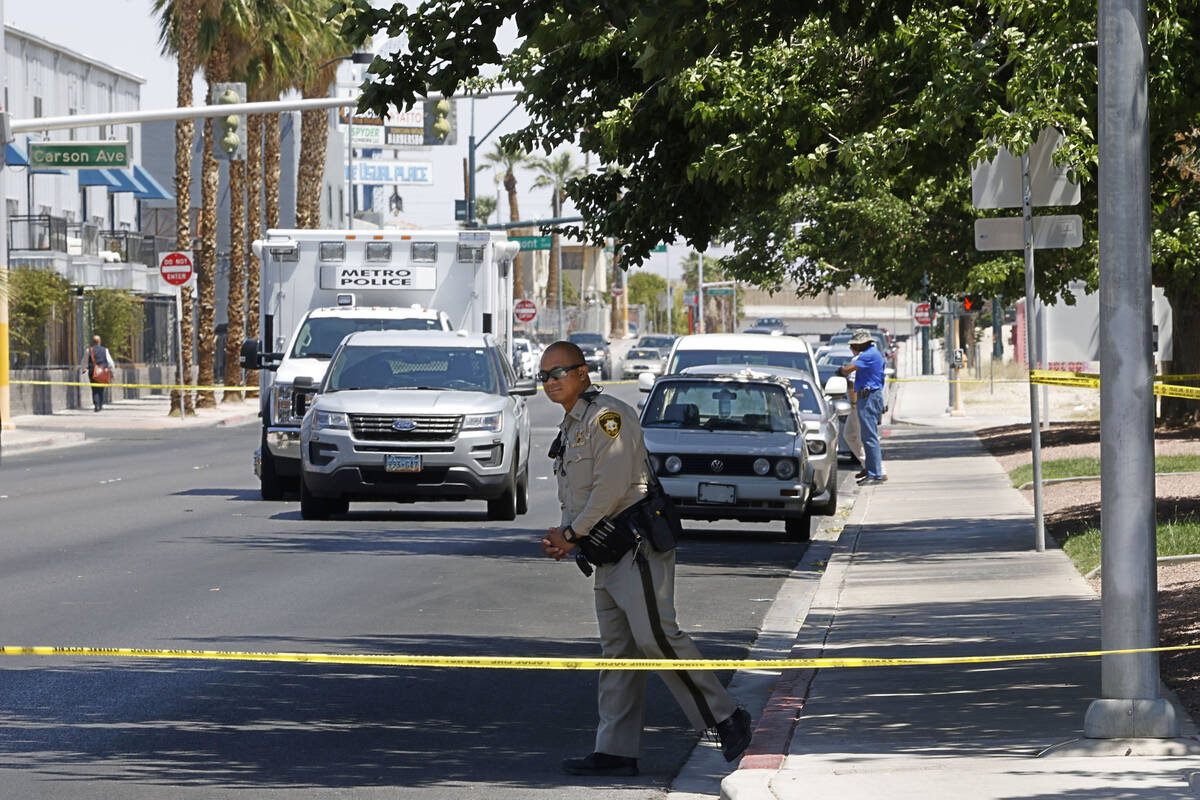 Las Vegas police investigate around the 200 block of Maryland Parkway, near Fremont Street, Sun ...