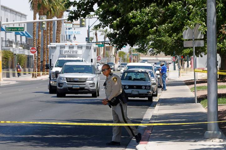 Las Vegas police investigate around the 200 block of Maryland Parkway, near Fremont Street, Sun ...