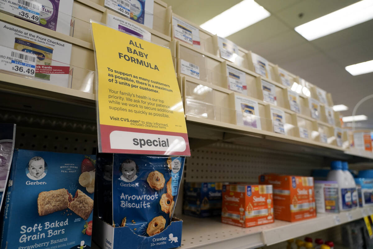 A sign is posted at a CVS pharmacy indicating a shortage in the availability of baby food Tuesd ...
