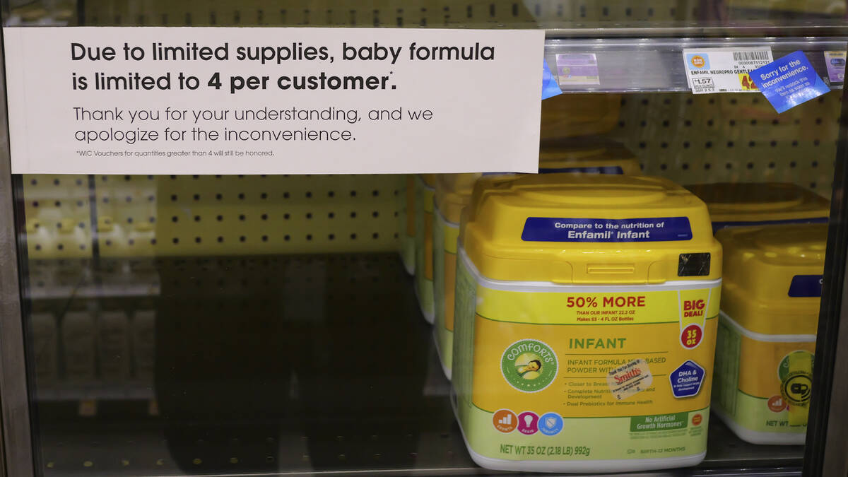 A due to limited supplies sign is displayed on the baby formula shelf at a grocery store Tuesda ...