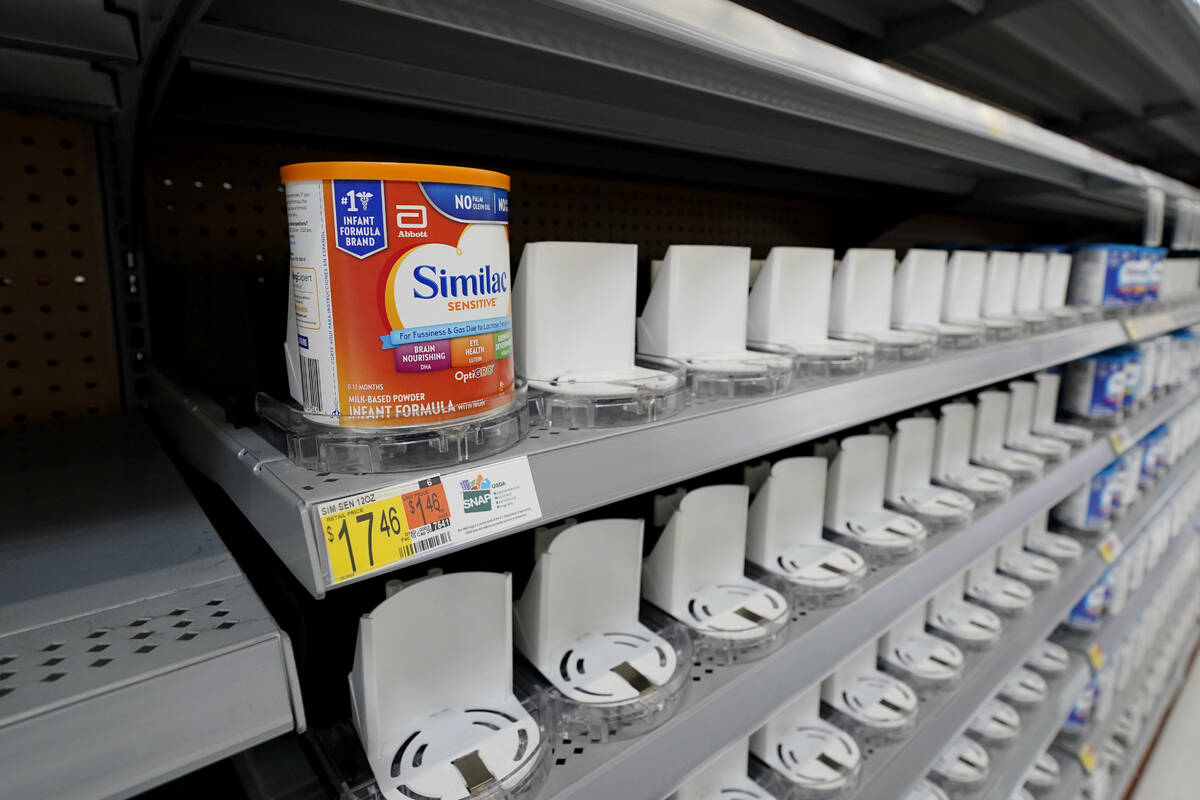 Shelves typically stocked with baby formula sit mostly empty at a store in San Antonio, Tuesday ...