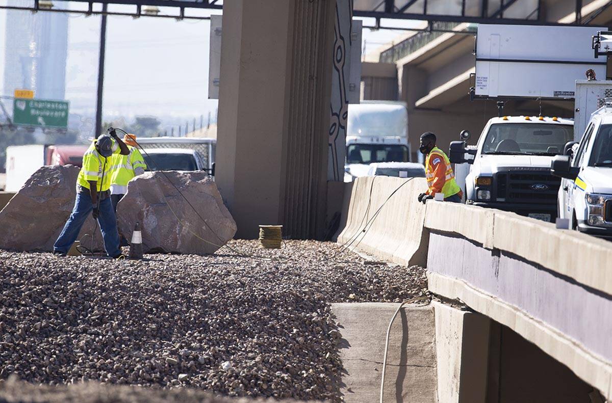 NDOT workers replace copper wire after Spaghetti Bowl lights were knocked out by copper wire th ...