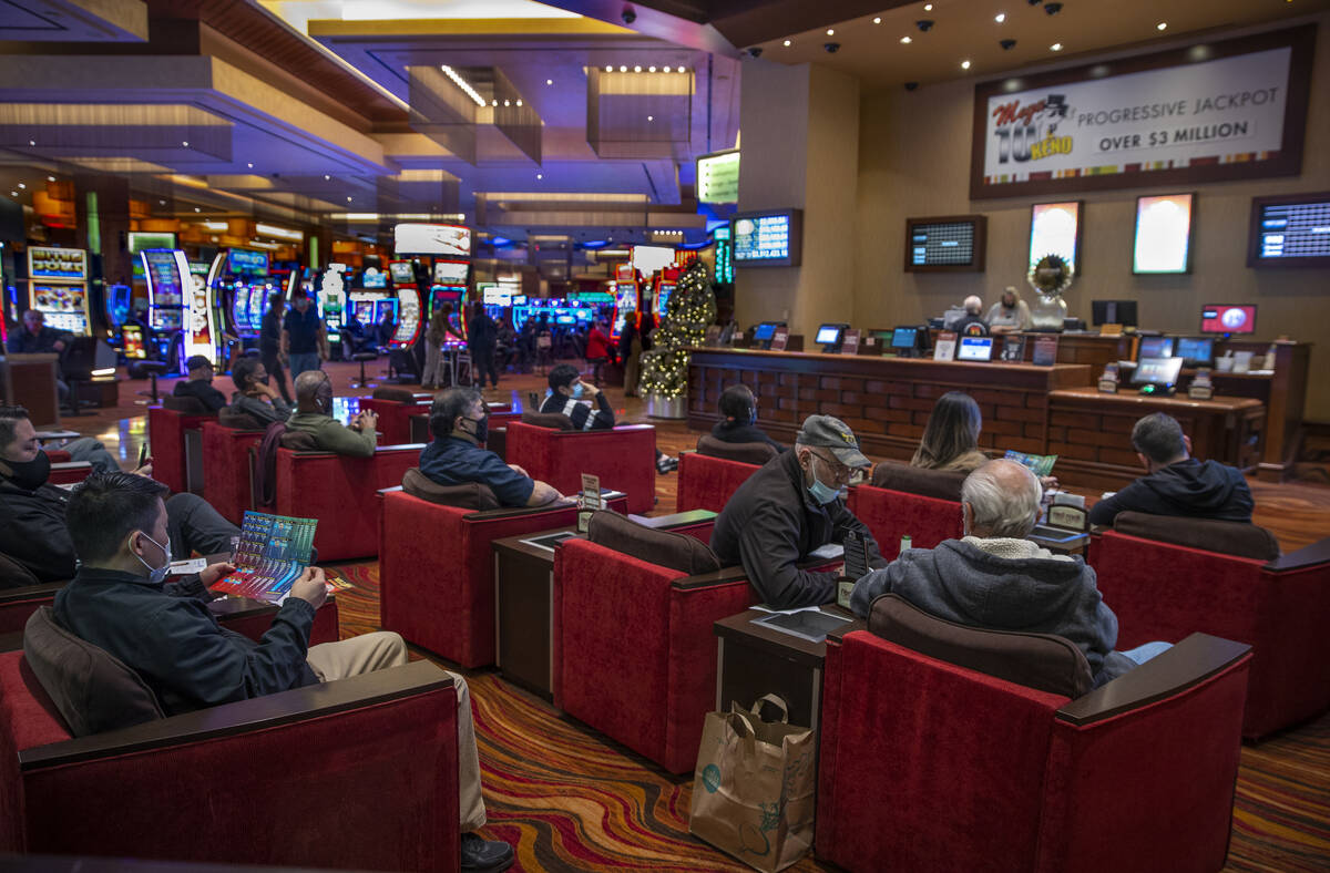 Guests play Keno on the gaming floor at Red Rock Casino on Tuesday, Dec. 26, 2021, in Las Vegas ...