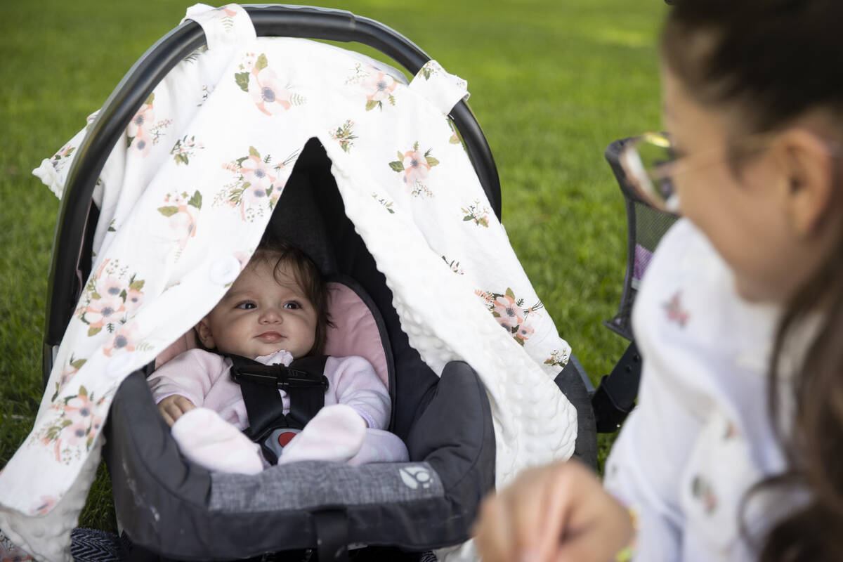 Jessica Pitts looks at her 5-month-old Wisely, at Mission Hills Park in Henderson, Thursday, Ma ...